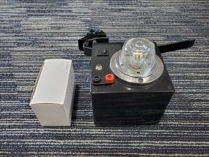Photo of a Remote Strobe device and power adapter box